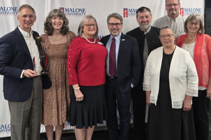 Greg and Darla Miller standing alongside ProVia representatives.