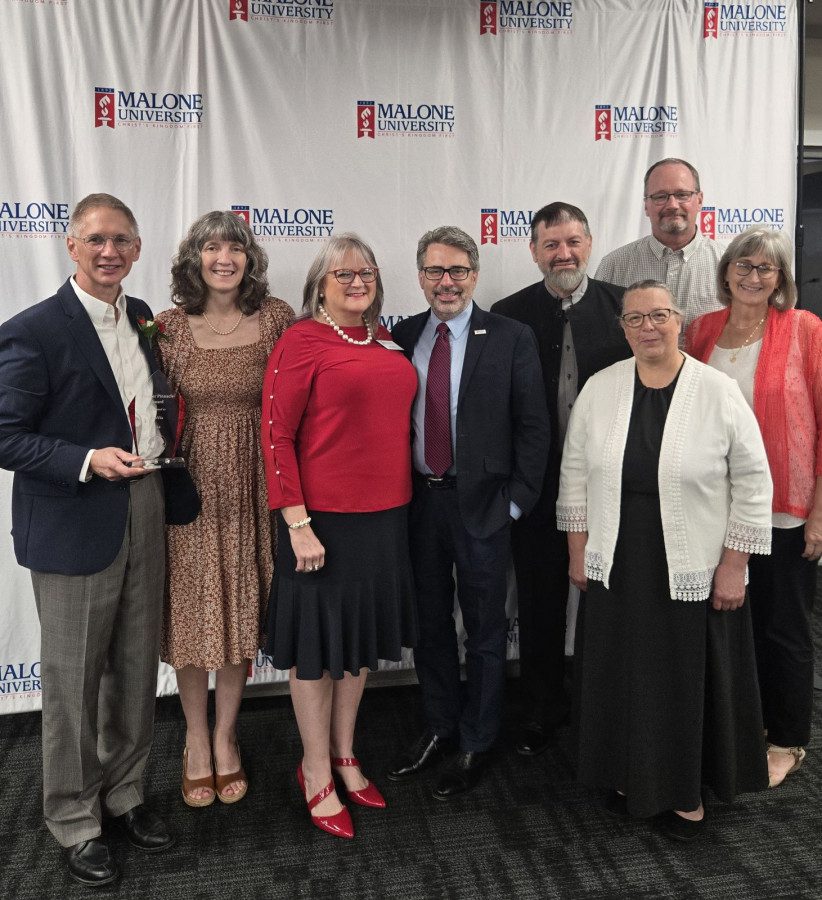 Greg and Darla Miller standing alongside ProVia representatives.