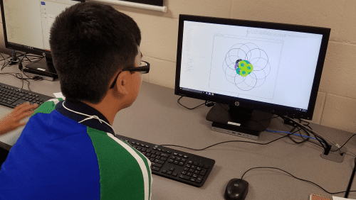 a guy looking at a computer screen