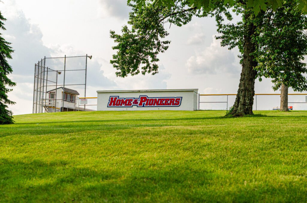 Home of the Pioneers dugout campus shot