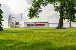 Home of the Pioneers dugout campus shot